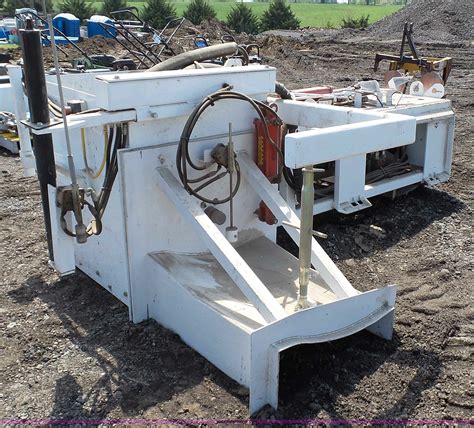 skid steer on curb|asphalt skid steer attachment.